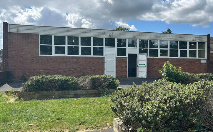 Back view of the Lock Lane Centre on Back William Street Castleford. Single storey building with white windows and brown brick
