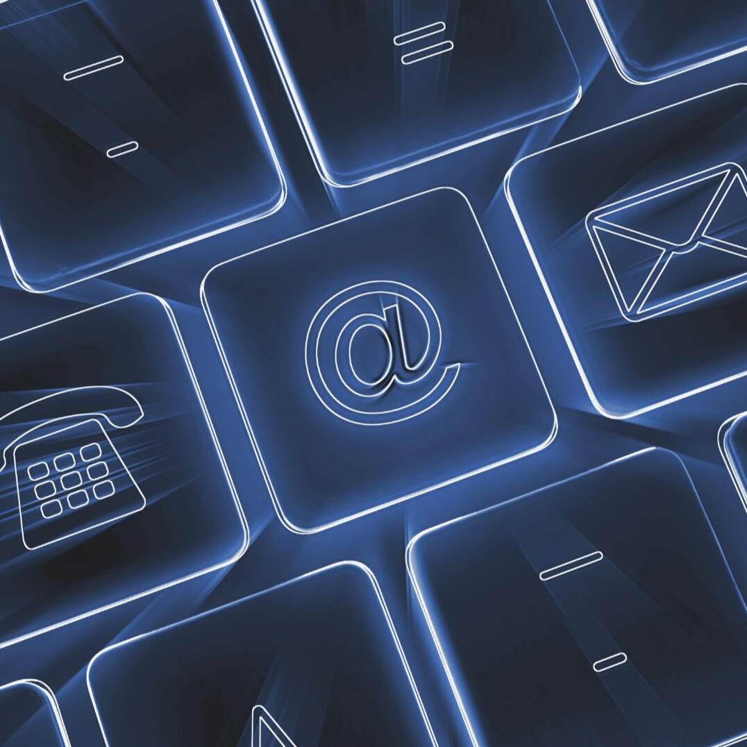 Keyboard keys, lit up with blue light